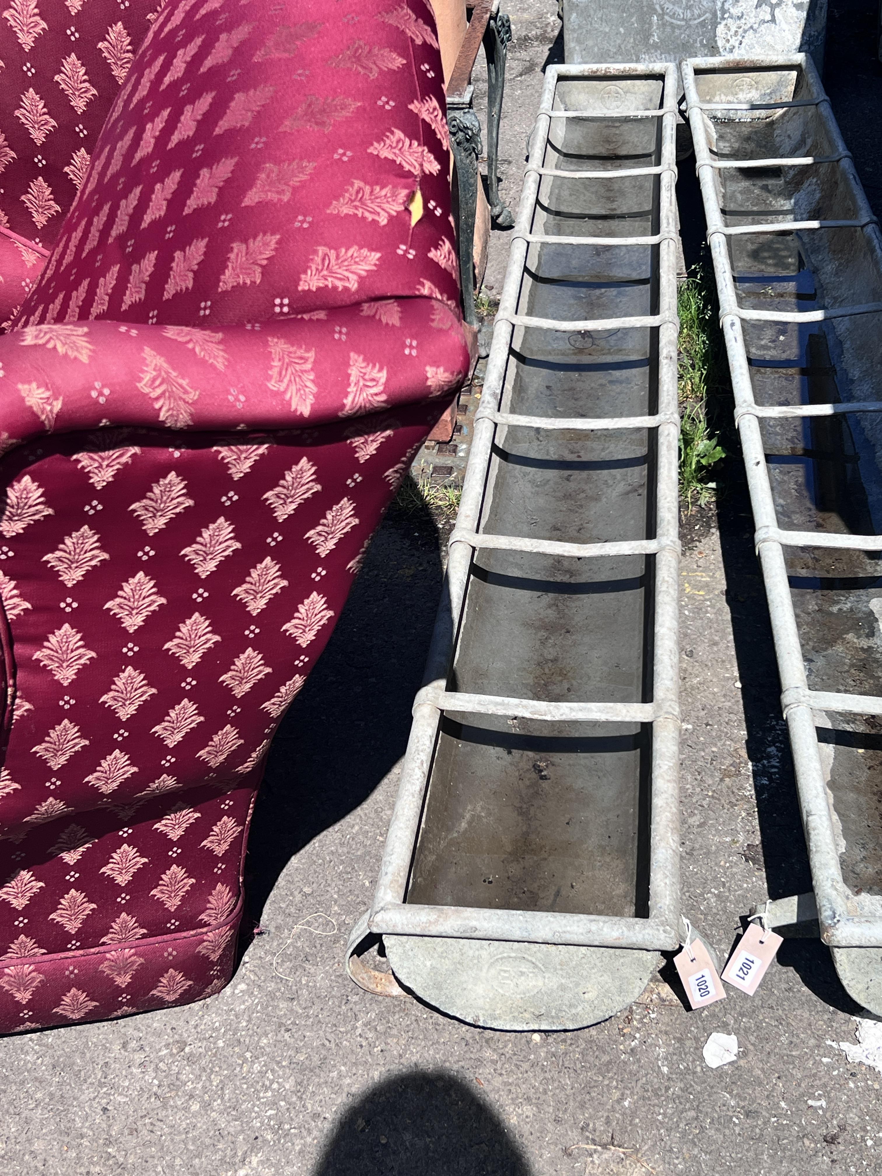 A galvanised feeding trough, length 247cm, depth 28cm, height 20cm